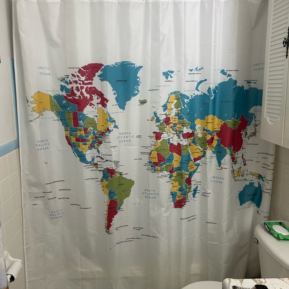 Beautiful and educative shower white curtain with world map in color.